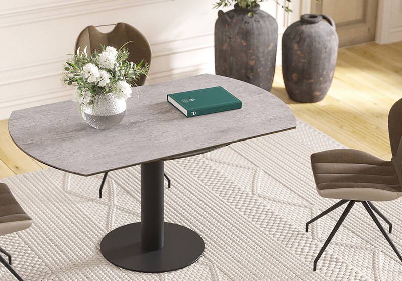 Leena dining table in a room with chairs around it
