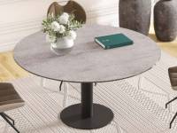 Leena dining table in a room with chairs around