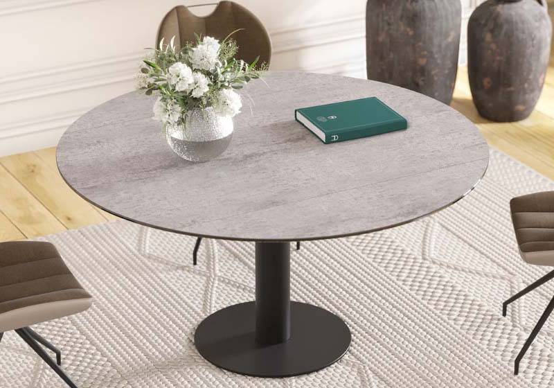 Leena dining table in a room with chairs around