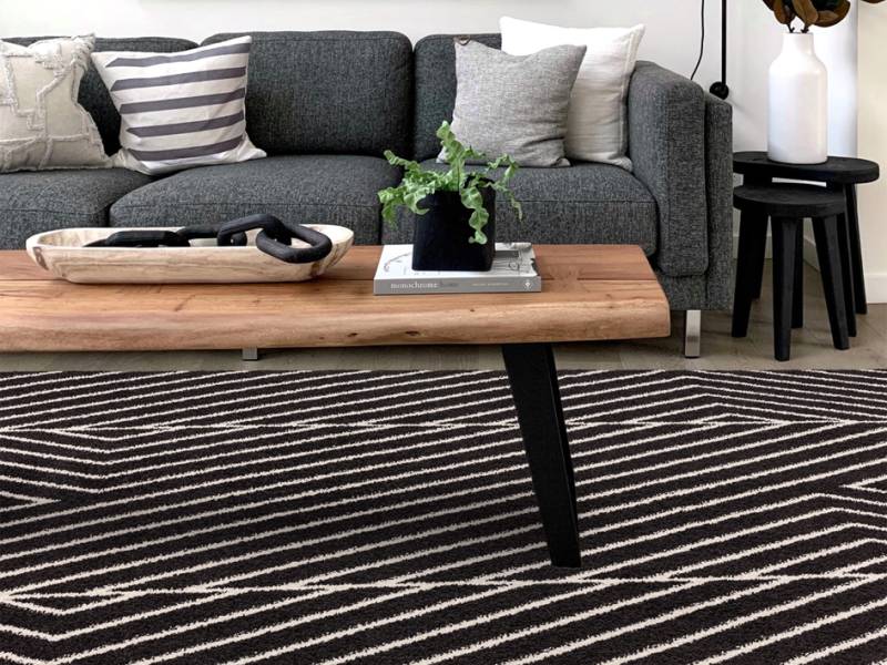 Muse Black Linear Rug in a living room