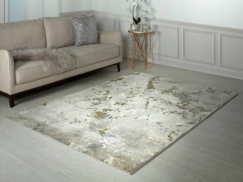 Aurora galaxy metallic gold rug in a living room