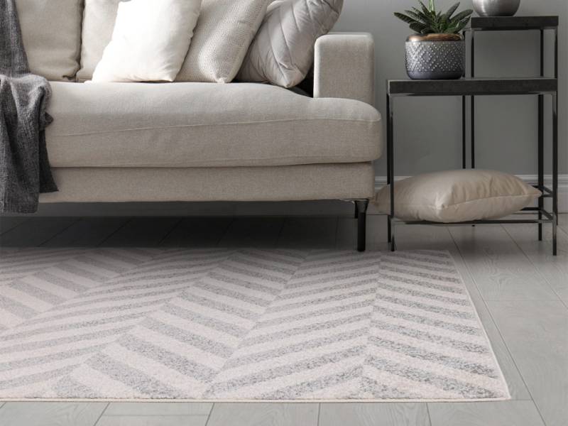Muse grey chevron rug in a living room