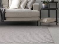 Muse grey linear rug in a living room