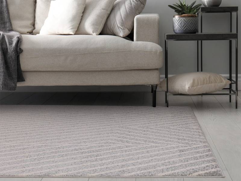 Muse grey linear rug in a living room