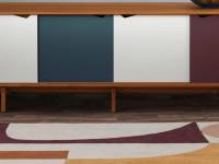 Reef rug in a room with a cabinet