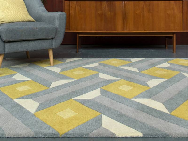 Reef rug in a room with chair and cabinet
