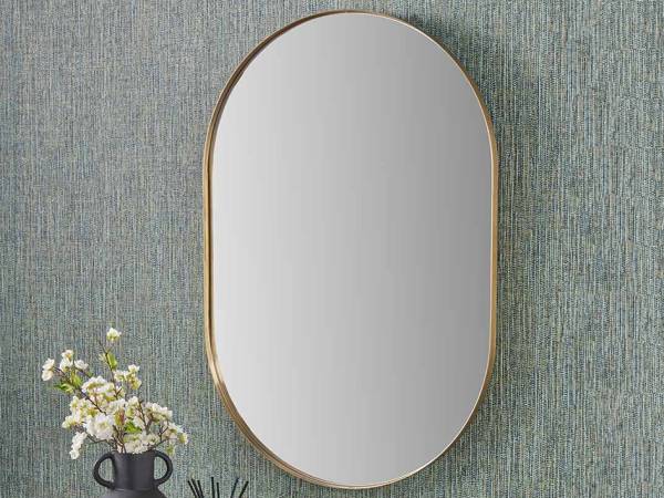 Gold effect metal oval mirror