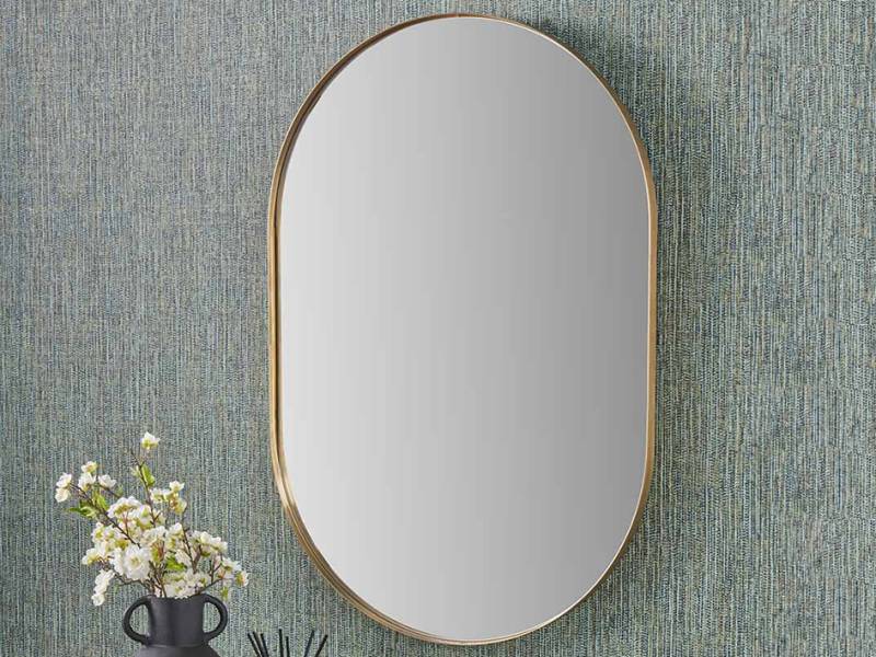 Gold effect metal oval mirror
